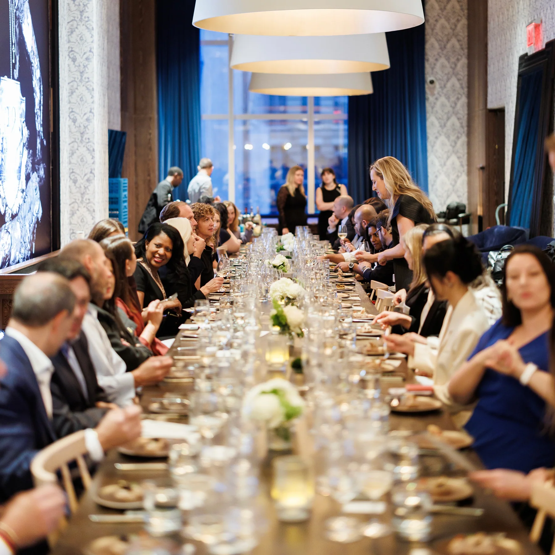 Leaders sharing conversation at an intimate Responsible Luxury salon dinner